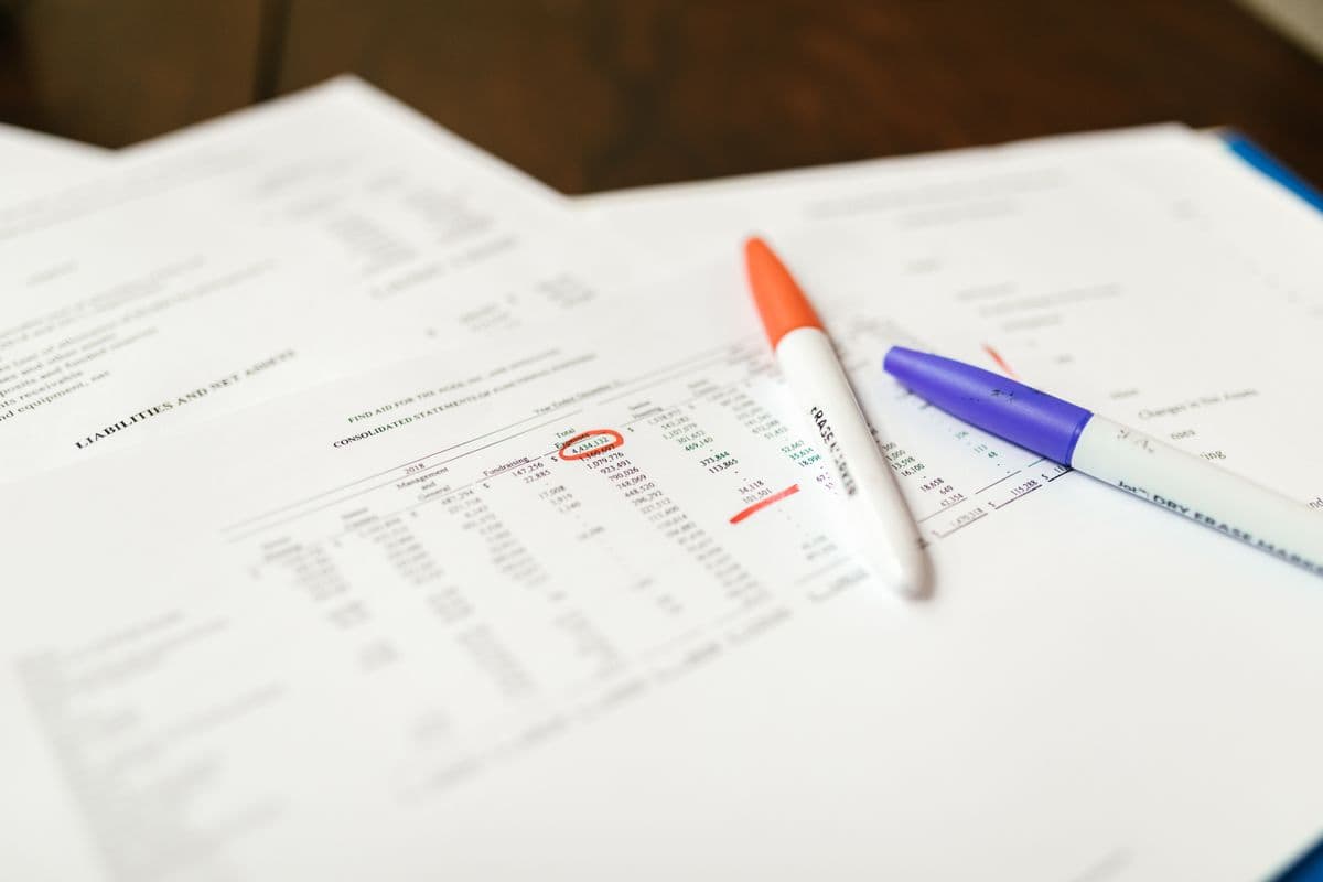 A document being reviewed and marked up with highlighters